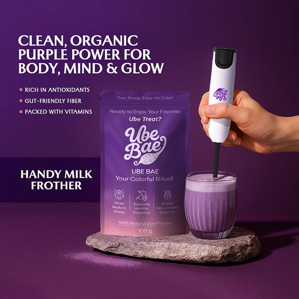 Ube Bae handy milk frother whipping an ube latte next to a pouch of organic ube powder