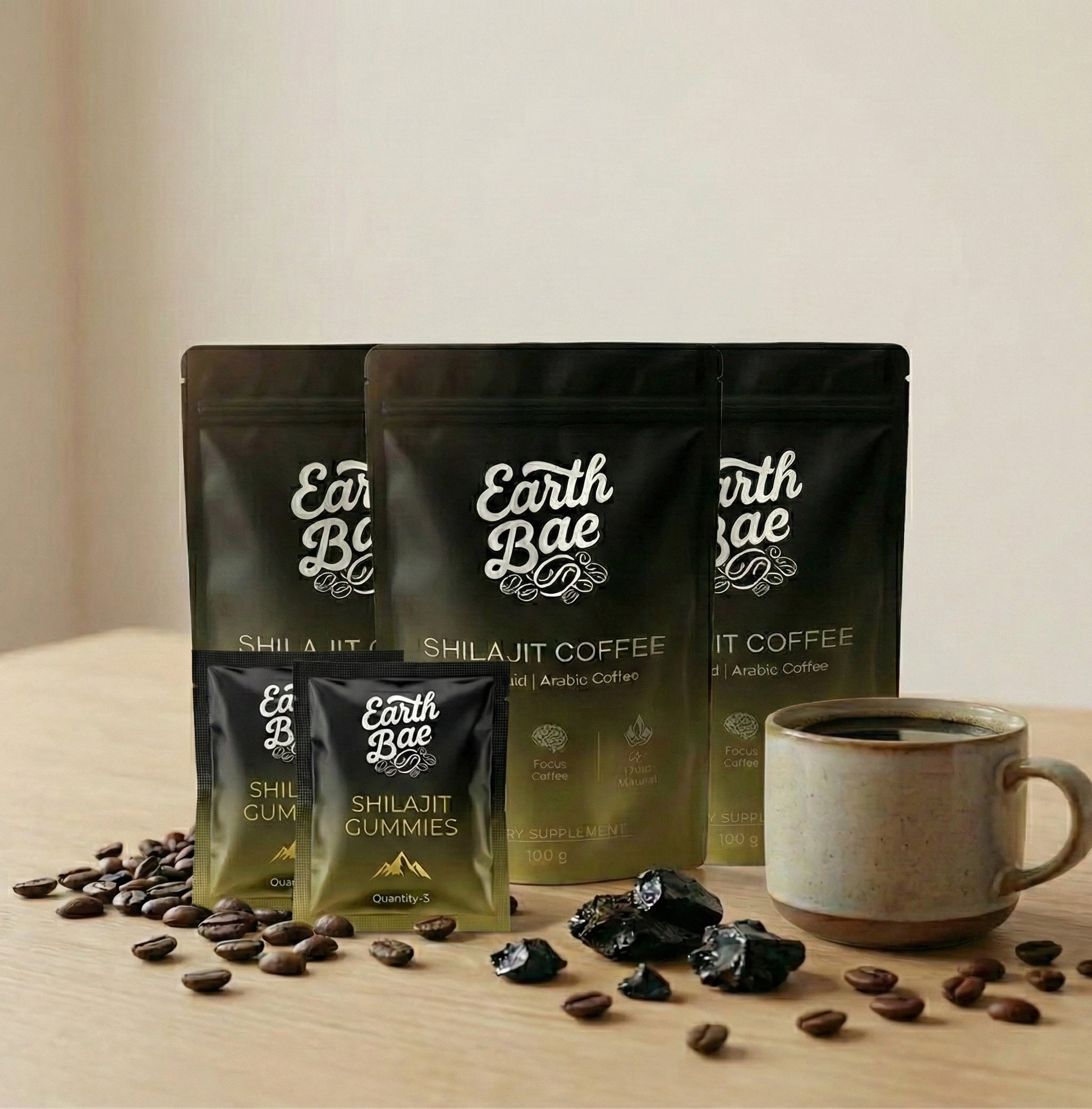 Earth Bae organic shilajit coffee and gummies with a cup of coffee on a wooden surface.
