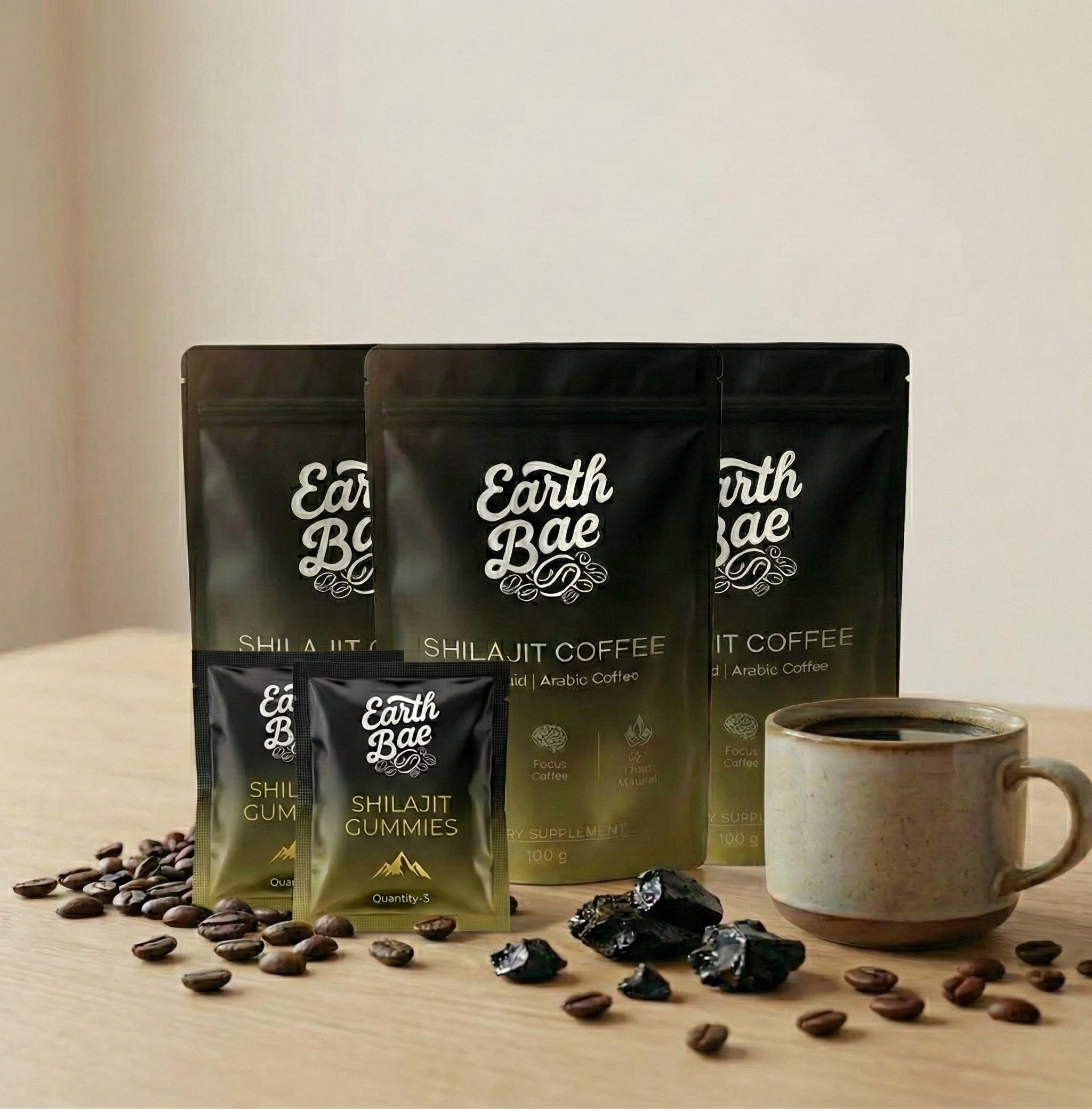 Earth Bae organic shilajit coffee and gummies with a cup of coffee on a wooden surface.