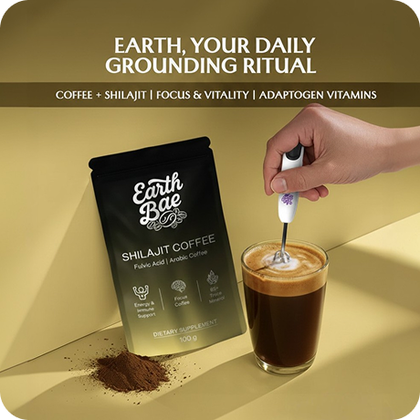 Earth Bae Shilajit Coffee packaging with a hand stirring a cup of coffee